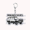 Silver acrylic keychain featuring a detailed model of an off-road truck