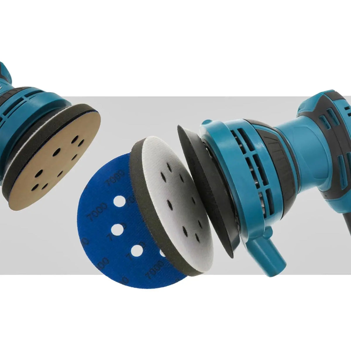 A close-up view of a blue abrasive interface pad and sanding disc with a white pad attached.