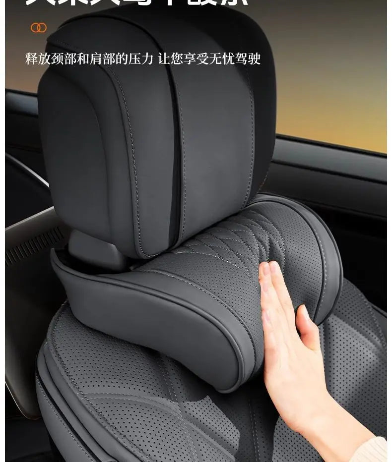 A close-up view of a black car neck pillow being placed on a car seat, demonstrating its design for enhanced comfort.