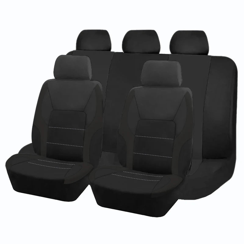 Ein Set schwarze universelle Autositzebezüge in einer Reihe.