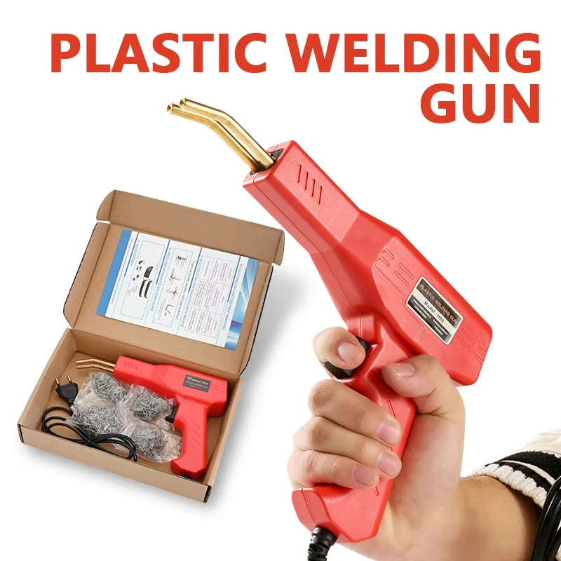 A hand holds a red plastic welding gun with a gold tip, next to its packaging.