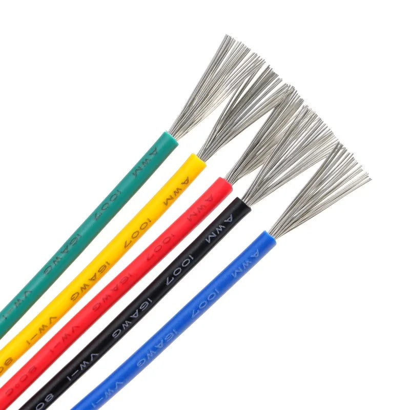 A collection of insulated multi-stranded copper wires in various colors including green, yellow, red, and blue.