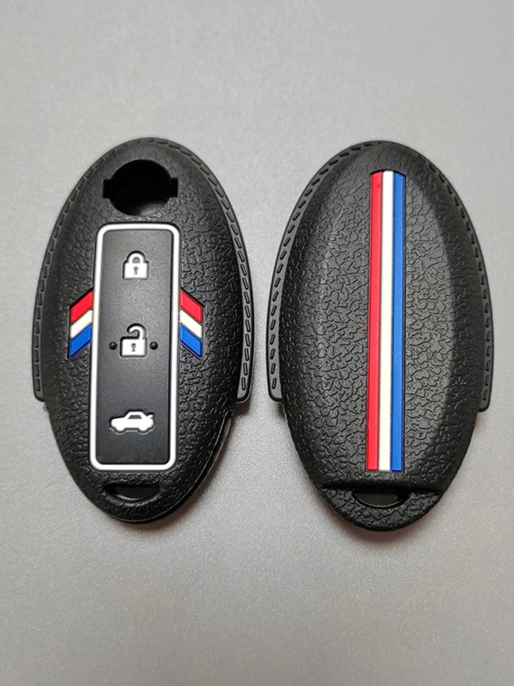 A black silicone car key fob cover with a transparent window showing a car silhouette and a national flag design.