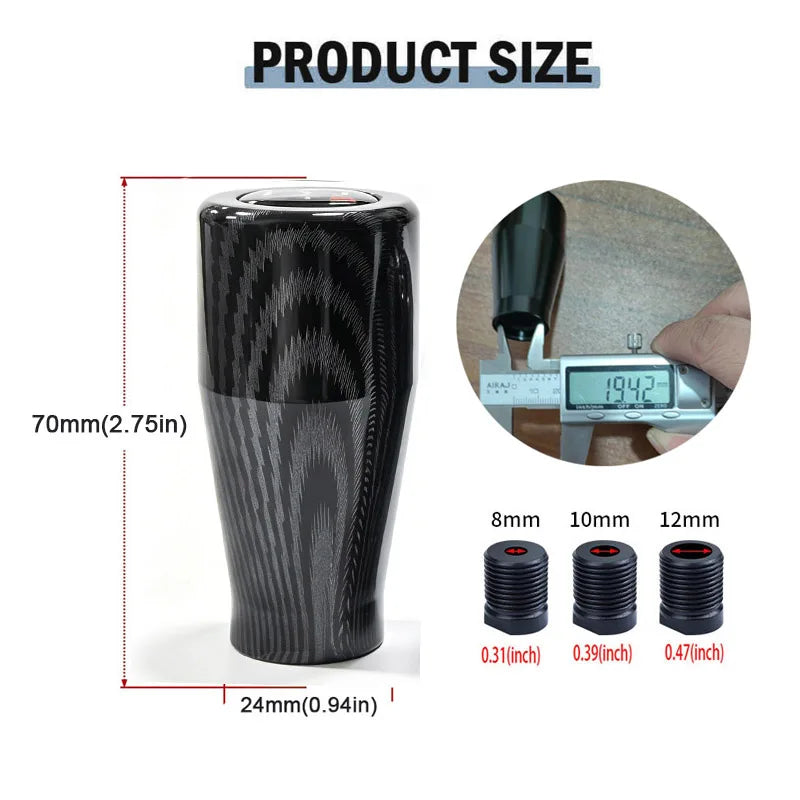 A black manual gear shift knob with a textured finish shown next to various size options.