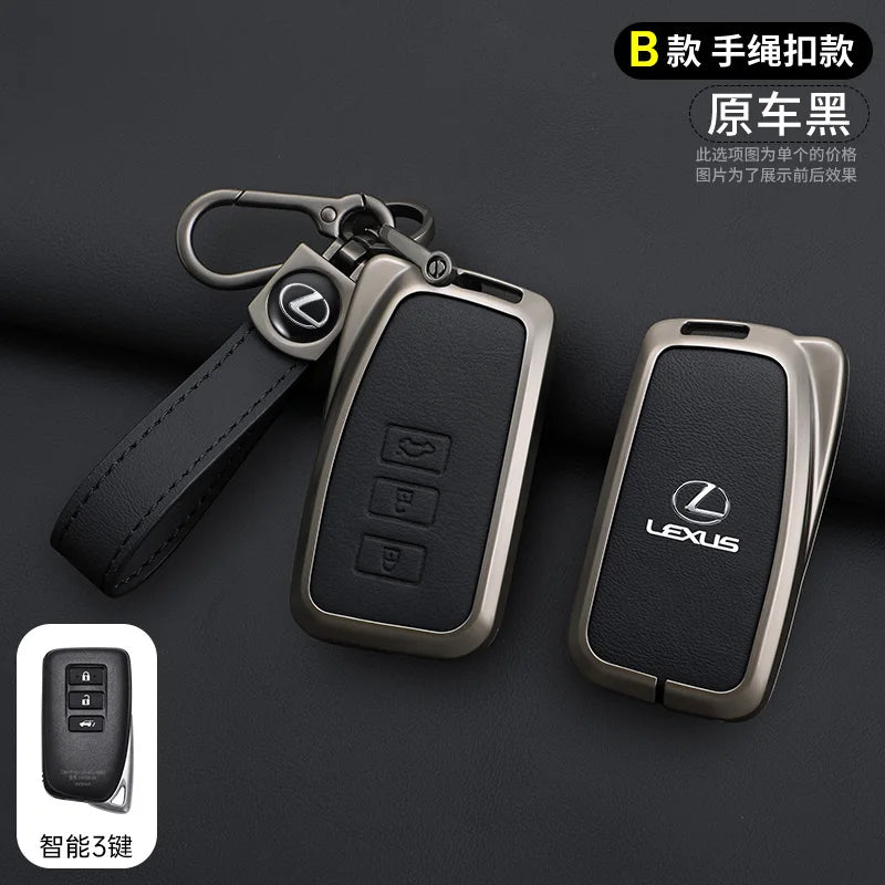 A black leather key cover shell for a Lexus car key, shown with an attached strap and a separate key fob.
