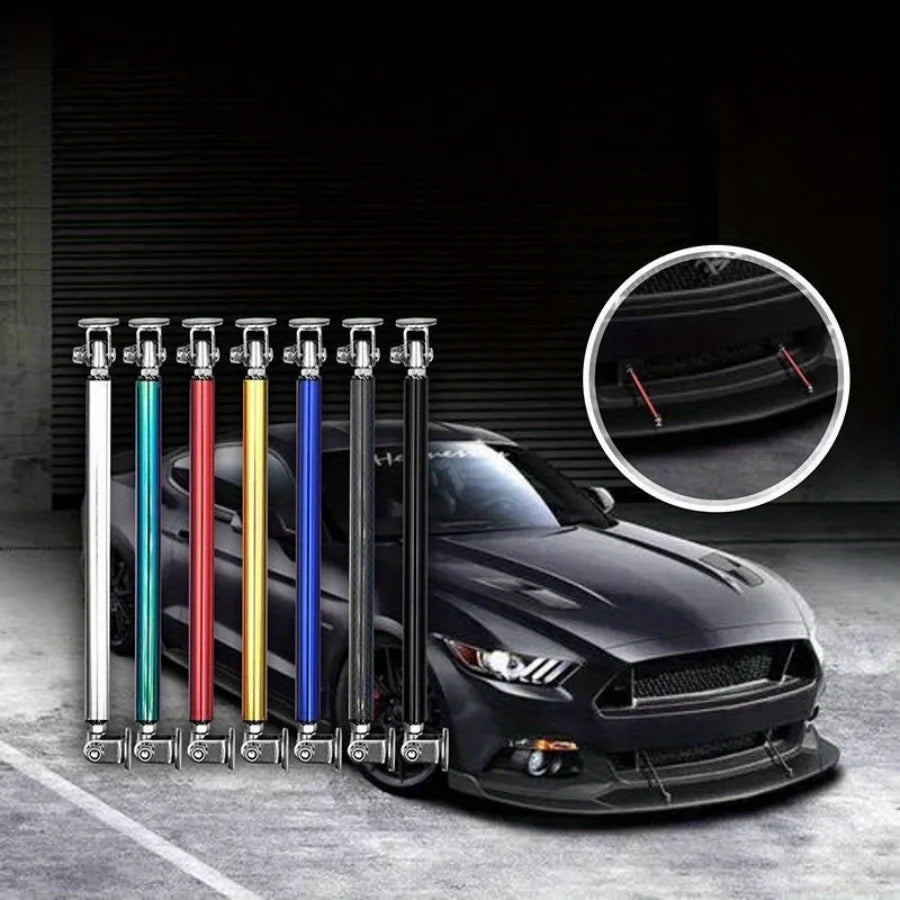 A black sports car is shown with multiple adjustable metal front lip support rods in various colors mounted on the bumper.