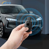 A hand holds a carbon fiber car key cover, demonstrating a product for Mercedes models.