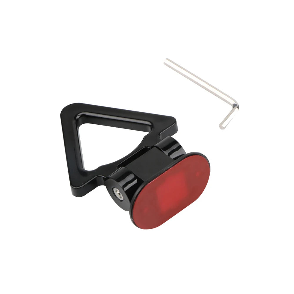 A black racing style car tow hook with a red light, mounted on a metal rod.