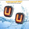 A waterproof LED license plate light with the letter U is shown being splashed by water.