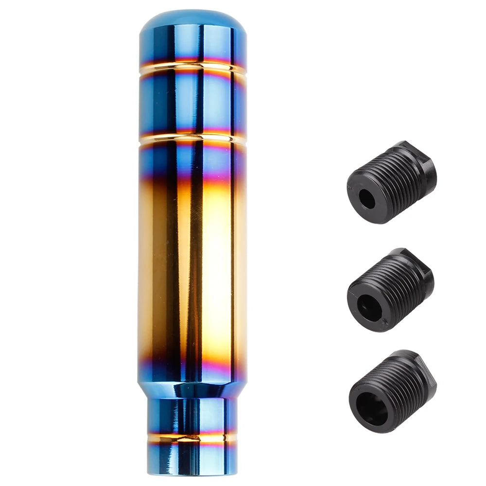 A close-up view of a blue and gold aluminum gear shift knob with a threaded base.