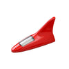 A red solar car antenna with a shark fin design mounted on a roof.
