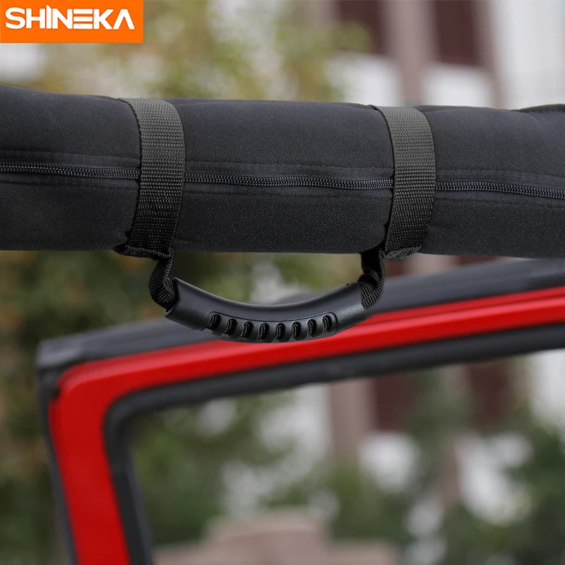 Black grab handles for a vehicle roll bar, used for off-road vehicles like Jeeps.