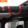 Red grab handles for a roll bar on an off-road vehicle.